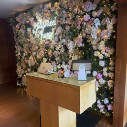 Flower wall at reception desk Flower wall at reception desk