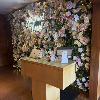 Plumed Horse - Flower wall at reception desk - French Near Me - Saratoga, California Plumed Horse - Flower wall at reception desk - French Near Me - Saratoga, California