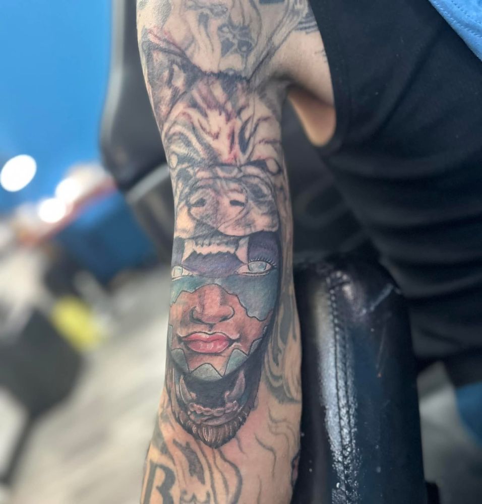 Artistic Tattoo and Art Gallery Logo