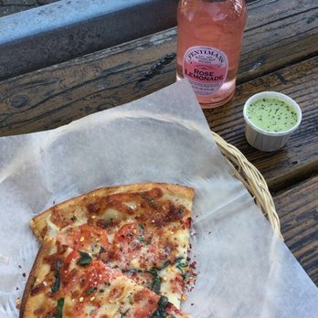Cheese Board Pizza - Some variation of Cheeseboard's tomato pizza, their green sauce, and rose lemonade - Pizza Near Me - Berkeley, California Cheese Board Pizza - Some variation of Cheeseboard's tomato pizza, their green sauce, and rose lemonade - Pizza Near Me - Berkeley, California