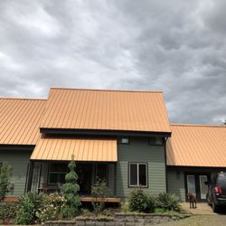 JT West Coast Gutter & Roofing - Copper Penny metal roof on this home in Silverton, OR