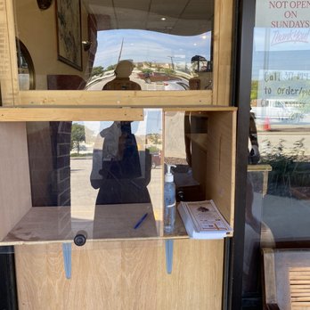 China Garden - a person taking a selfie through a window - Chinese Near Me - Carmel, Indiana