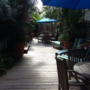 The Grand Guesthouse - Beautiful wooden walkways, with plenty of deck furniture and umbrellas to relax with - Bed & Breakfast Near Me - Key West, Florida