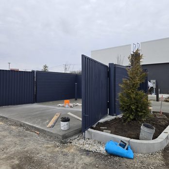Deras Painting Services - Completed blue accents: door, enclosures, ladder & posts gleaming under Plymouth sky. - Painters Near Me - Everett, Massachusetts Deras Painting Services - Completed blue accents: door, enclosures, ladder & posts gleaming under Plymouth sky. - Painters Near Me - Everett, Massachusetts