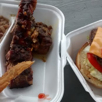 Blue Nile - Aerial shot of sampler with chitterlongs. Fry chx, GREAT rib even room temp, and curry goat. Grady burger on right ATW alltheway - Grocery Near Me - Saint Petersburg, Florida