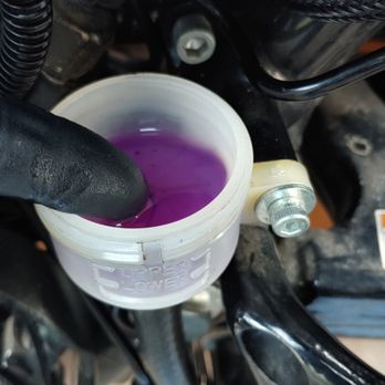 Fox River Harley-Davidson - As I bled off the clear liquid I poured more Dot5 in. You can see the purple Dot5 at the bottom and an 1/8" of the liquid they used on top - Motorcycle Dealers Near Me - St. Charles, Illinois Fox River Harley-Davidson - As I bled off the clear liquid I poured more Dot5 in. You can see the purple Dot5 at the bottom and an 1/8" of the liquid they used on top - Motorcycle Dealers Near Me - St. Charles, Illinois