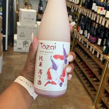 Liquid Assets - a person holding a bottle of wine - Beer, Wine & Spirits Near Me - Brooklyn, New York