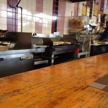 Corner Deli - a wooden counter in a restaurant - Delis Near Me - Bayside, New York Corner Deli - a wooden counter in a restaurant - Delis Near Me - Bayside, New York