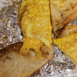 Burnt scrambled eggs and cheese on a semi burnt roll, never eating here again!!! Burnt scrambled eggs and cheese on a semi burnt roll, never eating here again!!!