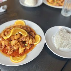 Orange chicken and a side of rice shaped like a heart