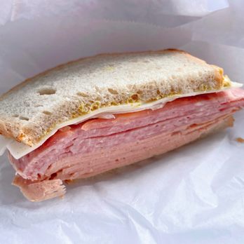 Seakor Polish Delicatessen - Cross section: Combo meat sandwich with onions, tomatoes, cheese, mayo, mustard. They ran out of lettuce. - Grocery Near Me - San Francisco, California Seakor Polish Delicatessen - Cross section: Combo meat sandwich with onions, tomatoes, cheese, mayo, mustard. They ran out of lettuce. - Grocery Near Me - San Francisco, California