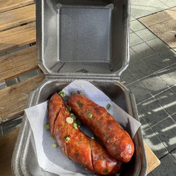 Zaap Lao and Thai Street Eats - two sausages in a container - Thai Near Me - Dallas, Texas Zaap Lao and Thai Street Eats - two sausages in a container - Thai Near Me - Dallas, Texas