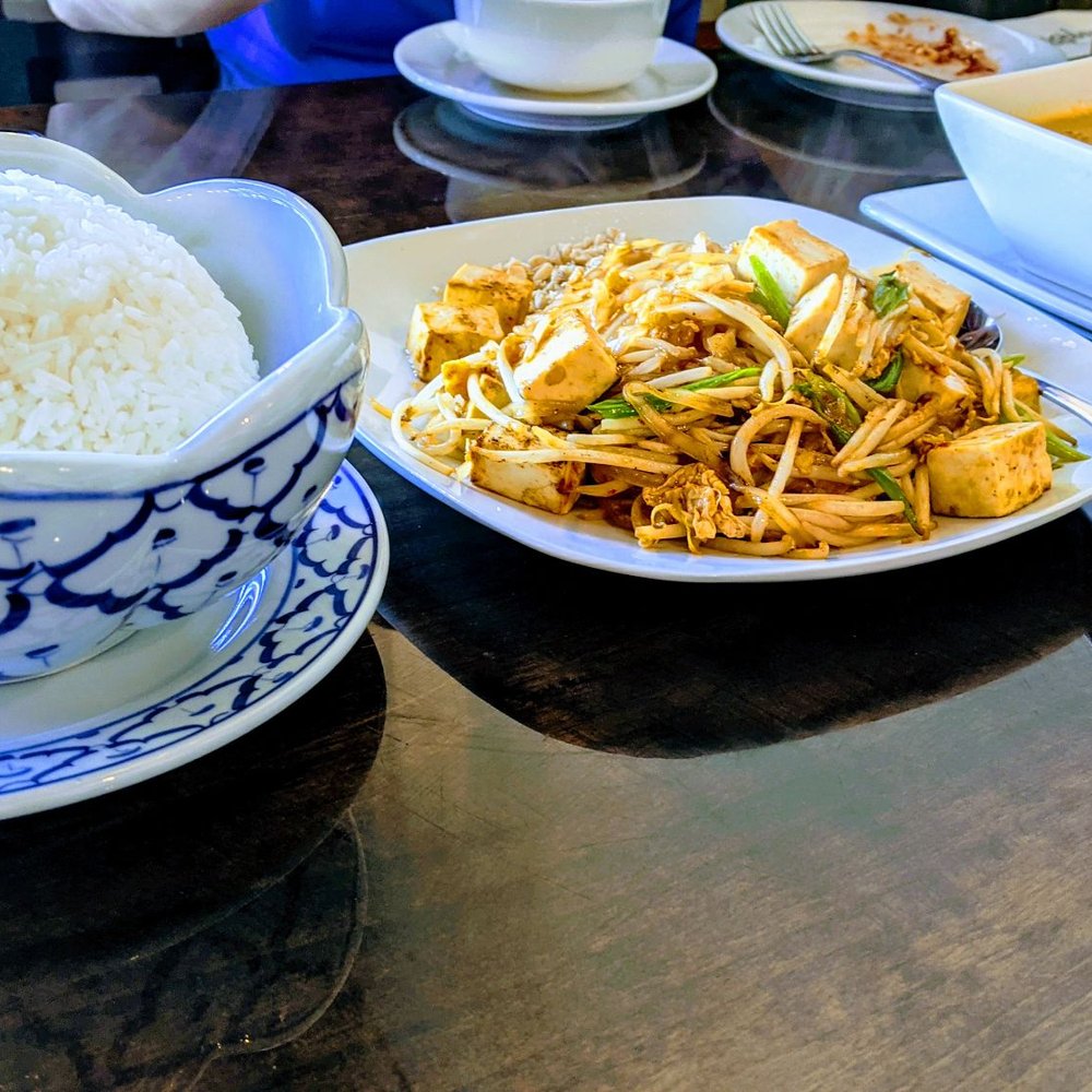 Eggplants Thai Cuisine - Rice for the Panang curry and crying tiger. Pad Thai with soft Tofu in the center. - Thai Near Me - Temecula, California Eggplants Thai Cuisine - Rice for the Panang curry and crying tiger. Pad Thai with soft Tofu in the center. - Thai Near Me - Temecula, California