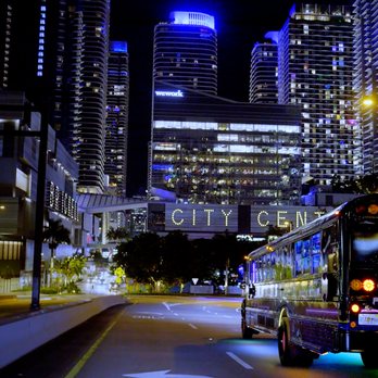 Party Buses 4 U - The Retro Neon riding into the night towards Brickell City Centre. - Party Bus Rentals Near Me Party Buses 4 U - The Retro Neon riding into the night towards Brickell City Centre. - Party Bus Rentals Near Me
