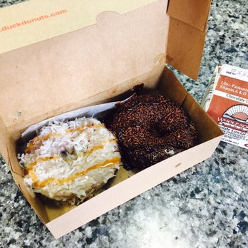 Duck Donuts - On left :Maple frosting with shredded coconut and caramel drizzle. On right: Chocolate frosting with choc sprinkles and hot fudge drizzle. - Donuts Near Me - Virginia Beach, Virginia Duck Donuts - On left :Maple frosting with shredded coconut and caramel drizzle. On right: Chocolate frosting with choc sprinkles and hot fudge drizzle. - Donuts Near Me - Virginia Beach, Virginia