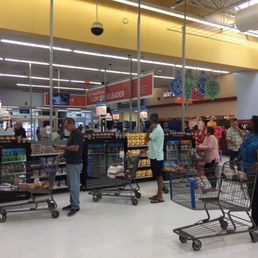 The line for self-service checkout is so long it's blocking entrance to store.