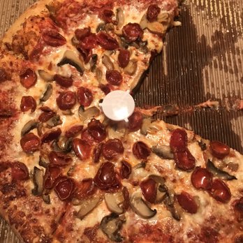 Marco's Pizza - a half eaten pizza in a box - Pizza Near Me - Ocean Springs, Mississippi