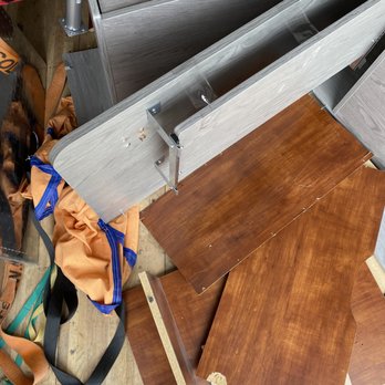 Kane and Family Movers - Broken desks and tv stand (after moving into different truck) - Movers Near Me