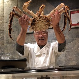Chef Eddie holding aloft an $800 Live King Crab!  Wow!
