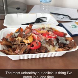 Cheese Curds Gourmet Burgers - Donair Poutine added banana peppers.