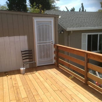 RMJ Concrete - Top view of deck leading to host rear door also installed door and screen door - General Contractors Near Me RMJ Concrete - Top view of deck leading to host rear door also installed door and screen door - General Contractors Near Me