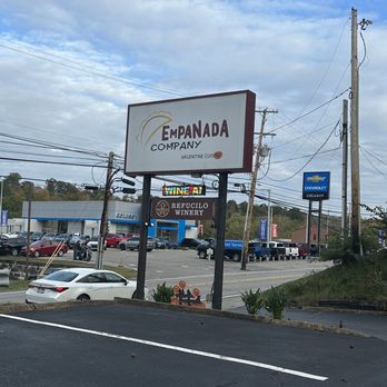 Empanada Company - Sign with dealership across the street - Argentine Near Me - Bridgeville, Pennsylvania