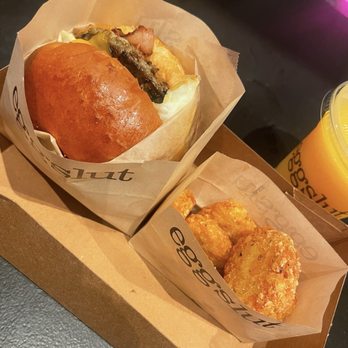 Eggslut - Truffle hashbrowns , bacon Bacon, Egg & Cheese plus sausage with OJ - Breakfast & Brunch Near Me - Las Vegas, Nevada Eggslut - Truffle hashbrowns , bacon Bacon, Egg & Cheese plus sausage with OJ - Breakfast & Brunch Near Me - Las Vegas, Nevada