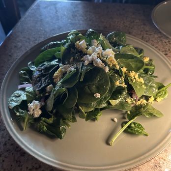 Péché - Spinach House Salad: House cured bacon, pickled onions, feta and warm honeyed red wine vinaigrette - Lounges Near Me - Austin, Texas Péché - Spinach House Salad: House cured bacon, pickled onions, feta and warm honeyed red wine vinaigrette - Lounges Near Me - Austin, Texas