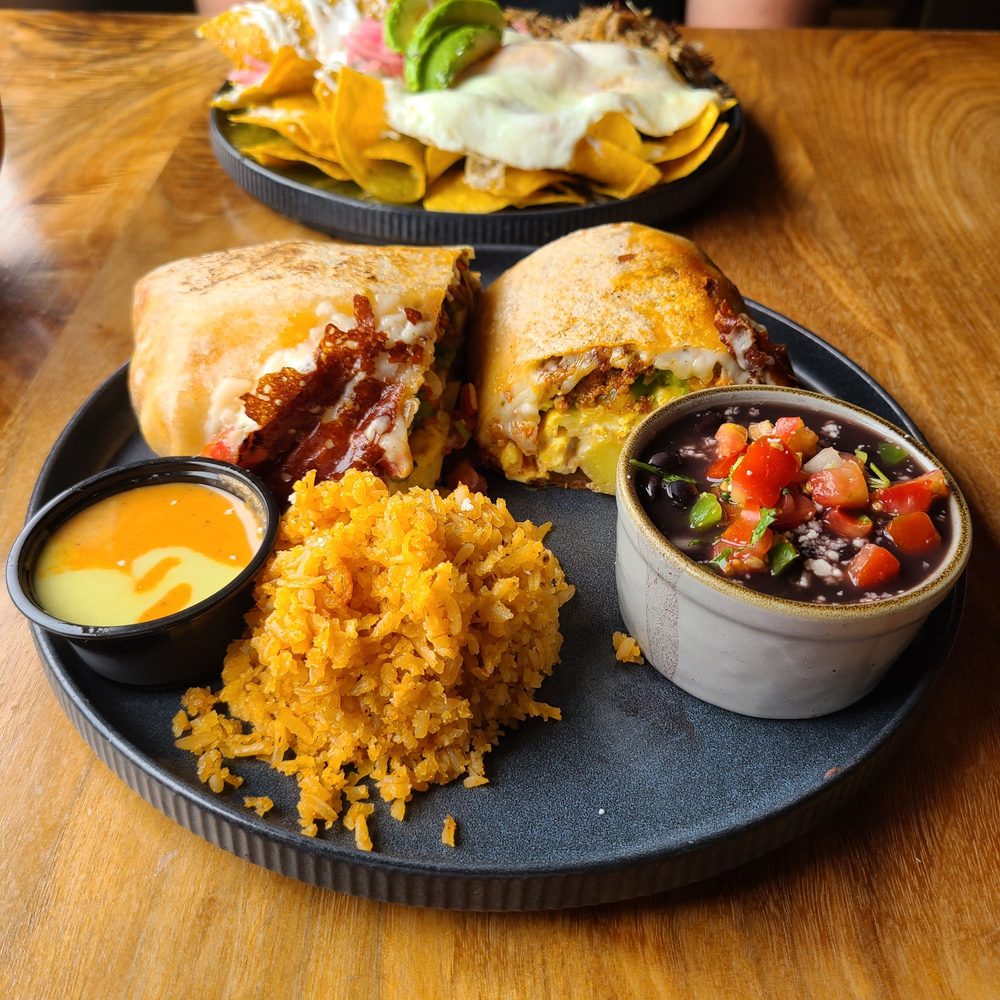 Chorizo Breakfast Burrito.  Comes w/ side of mexican rice, black beans (frijoles de la olla style), and 50/50 salsa mix.