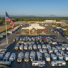 Exterior outside entrance of Camping World - Marysville - Camping World Marysville WA drone picture with flag and RVs - Marysville, Washington Exterior outside entrance of Camping World - Marysville - Camping World Marysville WA drone picture with flag and RVs - Marysville, Washington
