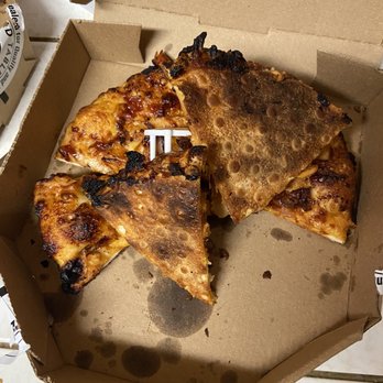 Round Table Pizza - a half eaten pizza in a cardboard box - Pizza Near Me - Corning, California