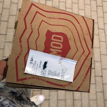 MOD Pizza - a person holding a pizza box - Fast Food Near Me - Riverdale Park, Maryland