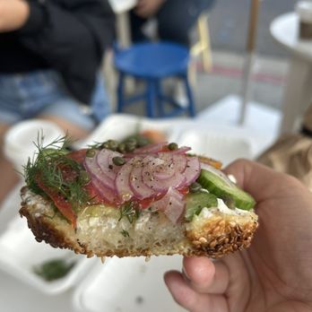 Courage Bagels - Half Run it Thru the Garden ($9) on sea salt sesame bagel cross section - Bagels Near Me - Los Angeles, California Courage Bagels - Half Run it Thru the Garden ($9) on sea salt sesame bagel cross section - Bagels Near Me - Los Angeles, California