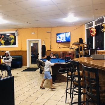 Estrella Hondumex - a young child playing pool in a restaurant - Mexican Near Me - Gatlinburg, Tennessee Estrella Hondumex - a young child playing pool in a restaurant - Mexican Near Me - Gatlinburg, Tennessee