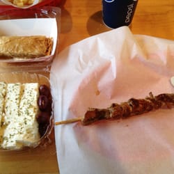 Souvlaki stick, feta cheese with kalamata olives and a baklava roll.