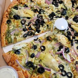 Build your own pizza. Artichoke, red onion, olives, feta, and pesto sauce.