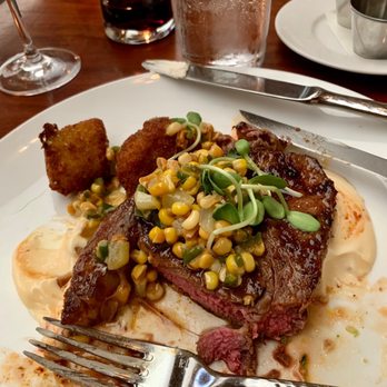 The Hive - Ribeye steak with corn salad and zucchini fritters - Southern Near Me - Bentonville, Arkansas The Hive - Ribeye steak with corn salad and zucchini fritters - Southern Near Me - Bentonville, Arkansas