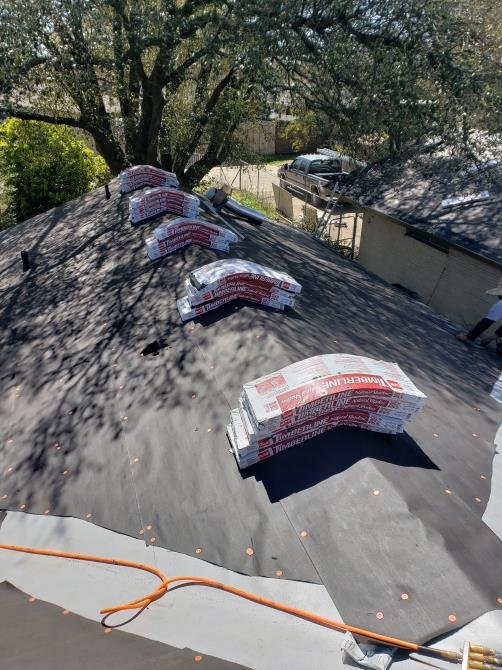 Slide of Luy's Roofing