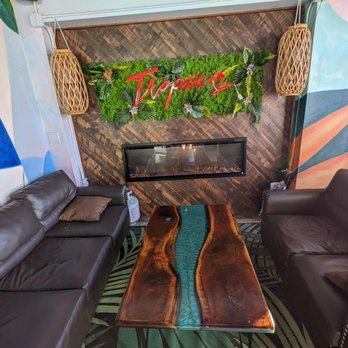 Tropics Cocktail Bar - a cozy spot in the dining room if you don't want the bar or taller bistro tables - Cocktail Bars Near Me - Cocoa Beach, Florida Tropics Cocktail Bar - a cozy spot in the dining room if you don't want the bar or taller bistro tables - Cocktail Bars Near Me - Cocoa Beach, Florida