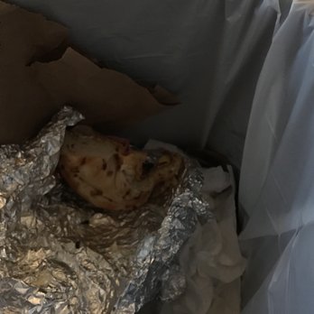 Steins Bagels - Incorrect and soggy breakfast sandwich from Steins tossed in the trash. - Bagels Near Me - Montvale, New Jersey