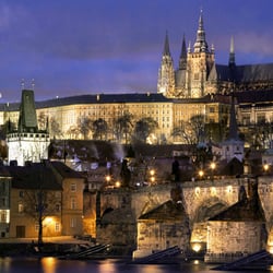 Custom Private Tours of Prague by Dana Jungrova - Prague Castle (Pražský hrad) looking across Charles Bridge (Karluv Most) in the evening.