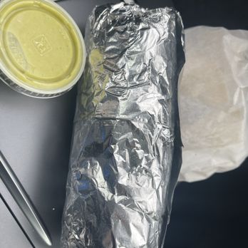 Carne asada burrito with green sauce