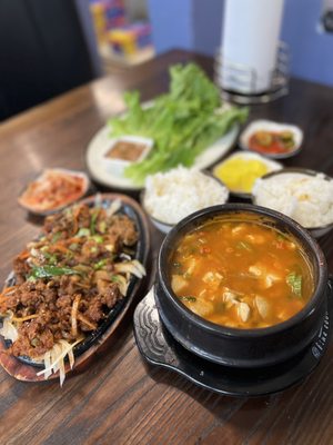 Photo of Chas Market & Kitchen - San Antonio, TX, US. Spicy Pork Bulgogi Dinner Plate, tofu stew, rice, lettuce and traditional Korean sides