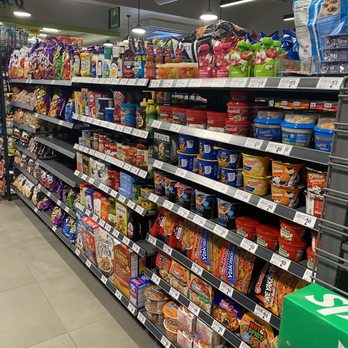 7 Eleven - a grocery store aisle with snacks and snacks - Gas Stations Near Me - Houston, Texas