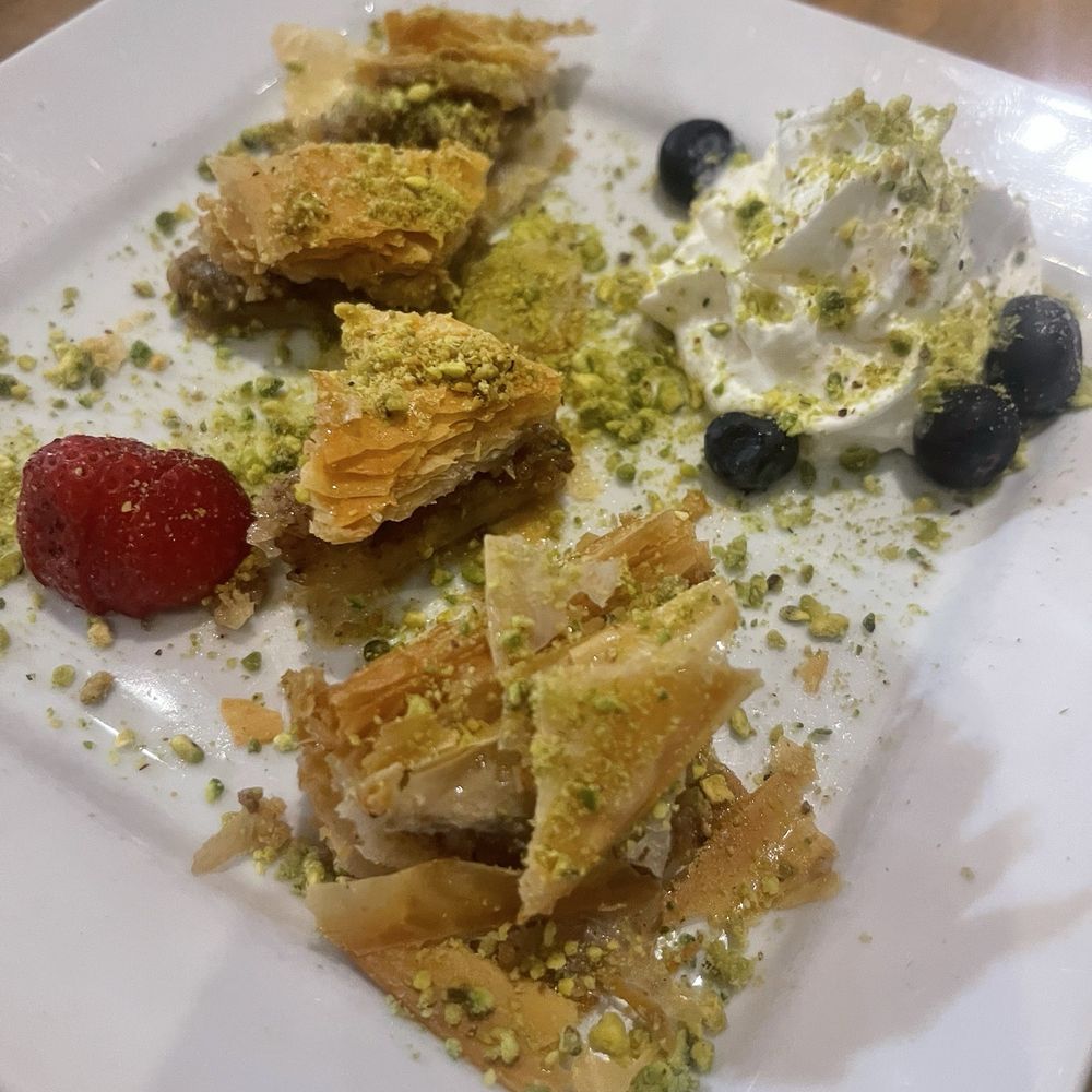 Rosine's Mediterranean Cafe - Flaky, buttery layers, perfectly sweet syrup, and just the right hint of richness,this baklava is pure dessert heaven! - Mediterranean Near Me - Anaheim, California Rosine's Mediterranean Cafe - Flaky, buttery layers, perfectly sweet syrup, and just the right hint of richness,this baklava is pure dessert heaven! - Mediterranean Near Me - Anaheim, California