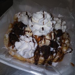 Funnel cake with brownies ice cream whip cream and chocolate