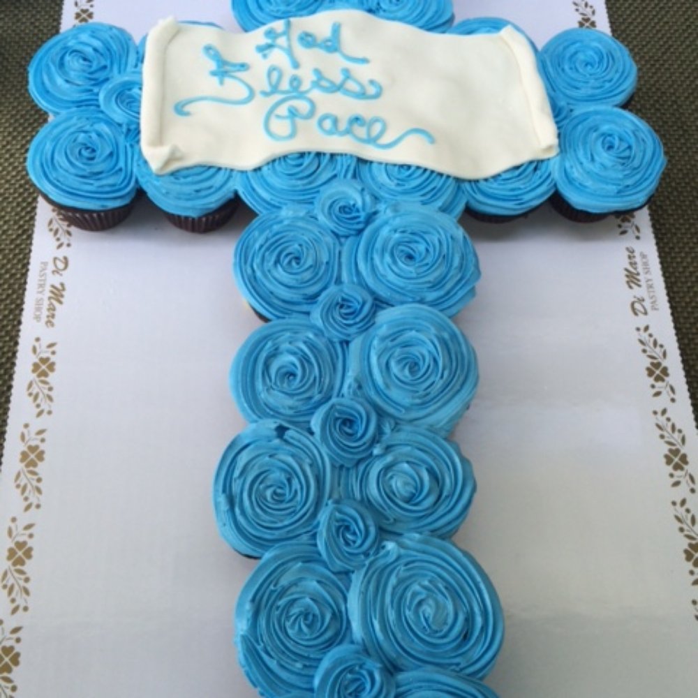 Our cross-shaped cupcake cake. Our cross-shaped cupcake cake.