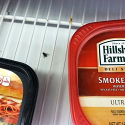 Pick ‘n Save - Dead fly, some hair, and lots of dust/debris on the shelf that the packaged meats sit on.  (photo taken on 10/21/2013)