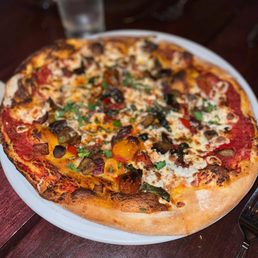 Caponata - roasted eggplant, moroccan black olives, cherry tomato, capers, basil, tomato sauce, and mozzarella (7/10)