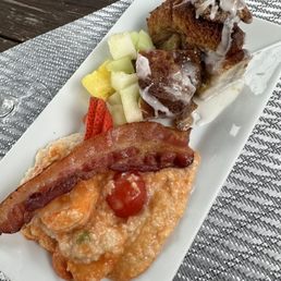 Shrimp and grits, bacon, fresh fruit and French toast. Shrimp and grits, bacon, fresh fruit and French toast.